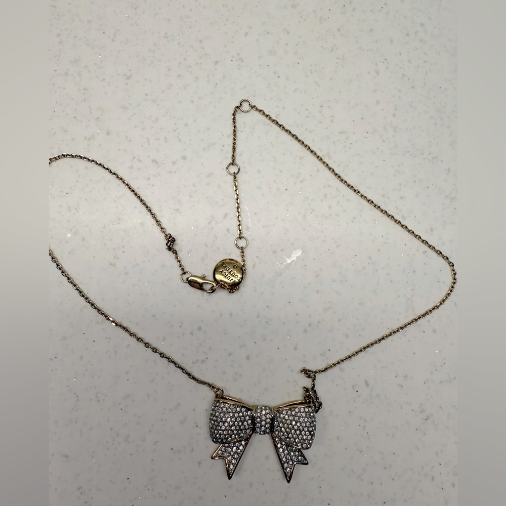 Juicy Couture brand necklace. Gold and diamonds.